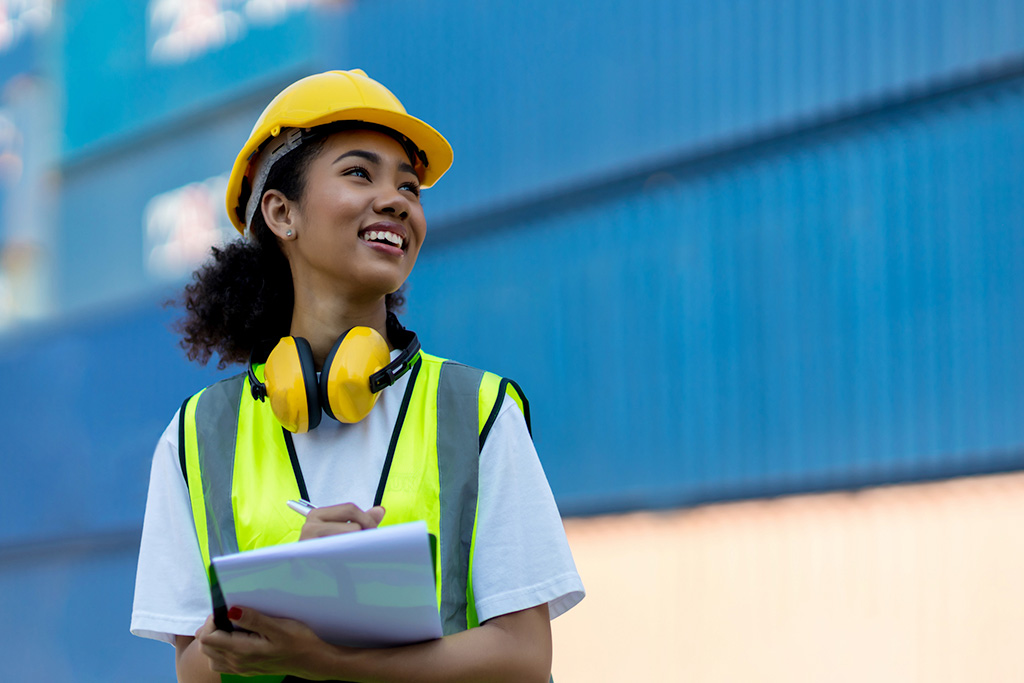 Female manufacturing worker with clip board